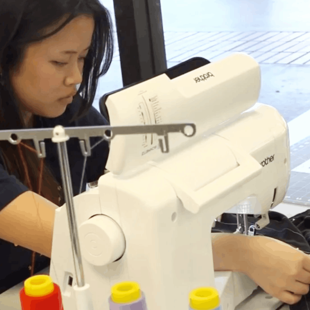 student using sewing machine
